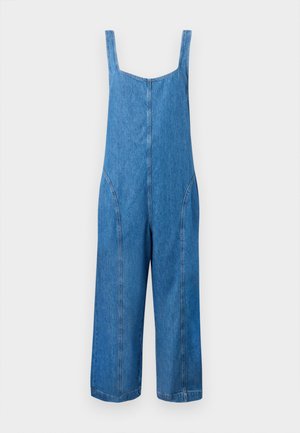 Salopette di denim in azzurro chiaro, con gambe ampie, bretelle e dettagli delle cuciture curve. Realizzata in morbido cotone con una texture liscia.