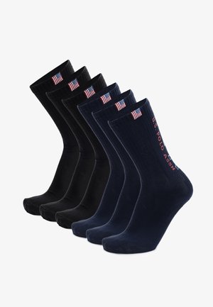 Set di sei calzini con colori solidi nero e blu navy. Realizzati in misto cotone, mostrano una texture a coste e il marchio U.S. Polo Assn.