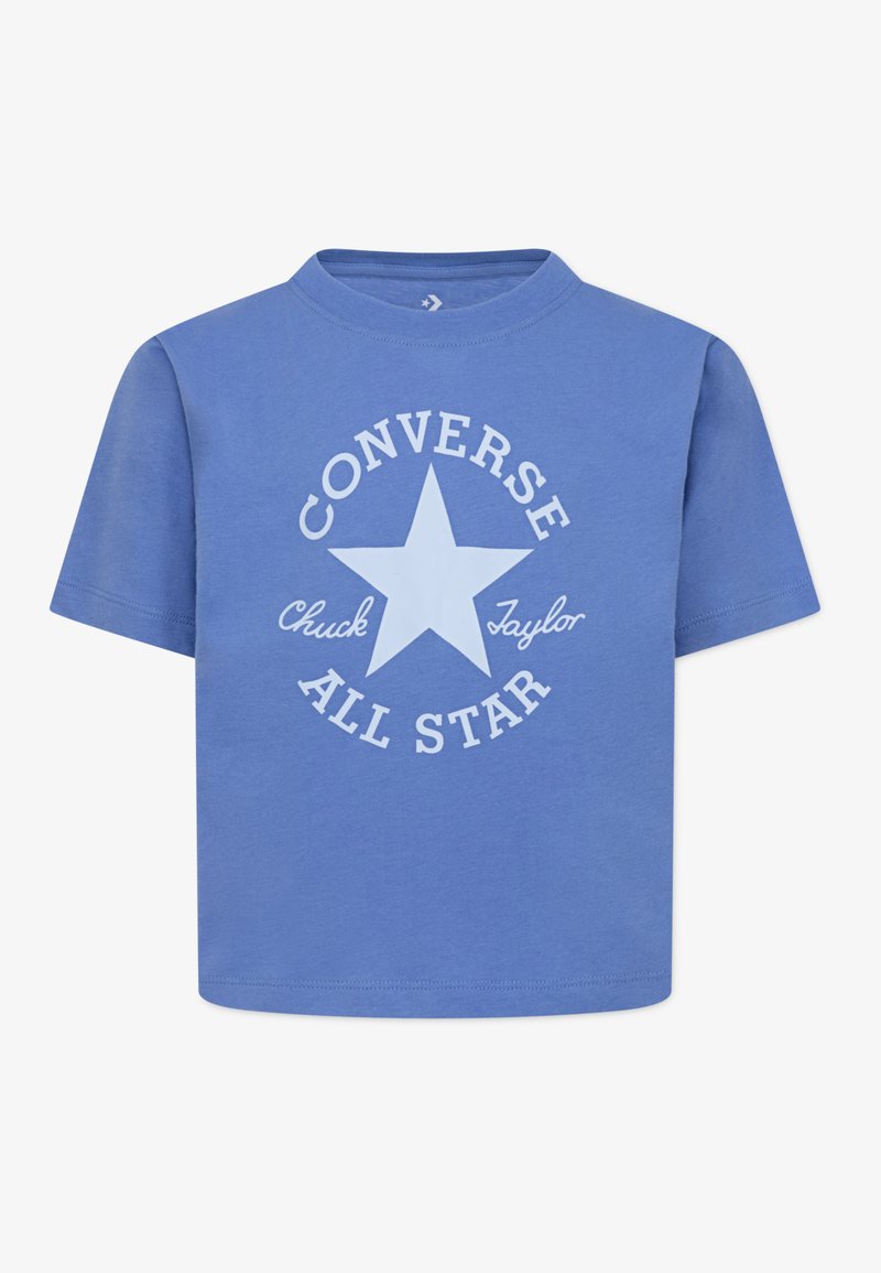 T-shirt di cotone blu con una grande stella bianca e la scritta "Converse All Star" in un design circolare. Maniche corte e scollatura rotonda.