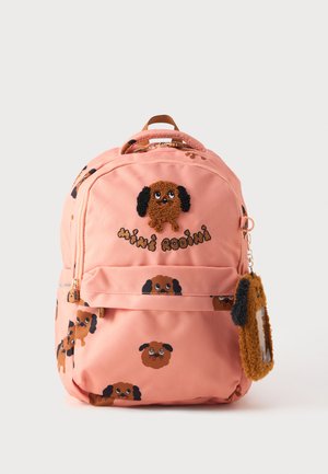 Rucsac roz cu desene cu câini de desene animate, texturi pufoase și un breloc în formă de câine căptușit. Inclusiv închideri cu fermoar și curele ajustabile.