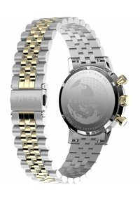 Reloj Timex con una correa de metal en acero inoxidable y tono dorado, bisel redondo negro y una caja trasera de plata con un diseño de globo.