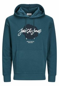 Sudadera color verde azulado hecha de una mezcla de algodón. Presenta un bolsillo delantero, capucha con cordón y un gráfico circular con texto en el pecho.