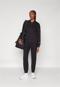 Champion ELASTIC CUFF PANTS QUICK DRY - Treniņtērpa apakšdaļas - black
