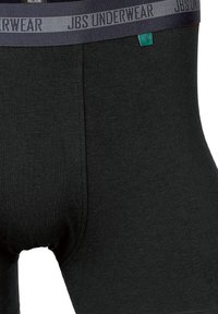 Mustat bokserit, jotka on valmistettu pehmeästä, teksturoidusta materiaalista. Niissä on harmaa joustovyötärö, jossa on "JBS UNDERWEAR" -logo ja pieni vihreä yksityiskohta.