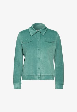 Giacca in corduroy turchese con colletto, chiusura frontale a bottoni, due tasche sul petto e polsini a costine. Texture liscia.