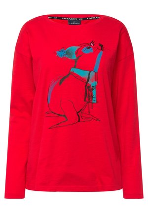 T-shirt rouge à manches longues avec un imprimé graphique bleu d'un lapin. Tissu doux, encolure ronde, coupe décontractée et coutures d'épaules tombantes.