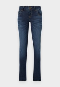 Úzke džínsy vyrobené z tmavomodrého denim. Majú dvojitý gombíkový zapínanie a päť vreciek. Švy vedú pozdĺž prednej a zadnej strany.