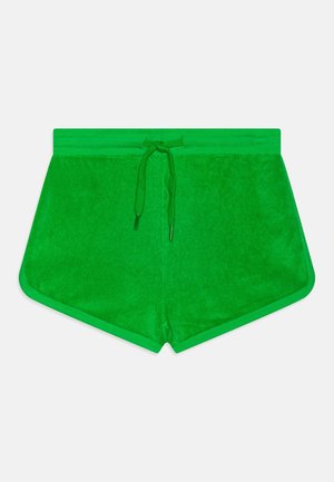 Shorts en éponge verts avec une ceinture à cordon, présentant une texture lisse et un galon contrastant le long des bords.