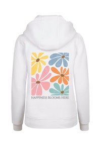 Felpa bianca con un design floreale colorato sul retro, caratterizzato da fiori gialli, rosa, blu, arancioni e turchesi. Il testo recita "LA FELICITÀ FIORISCE QUI."