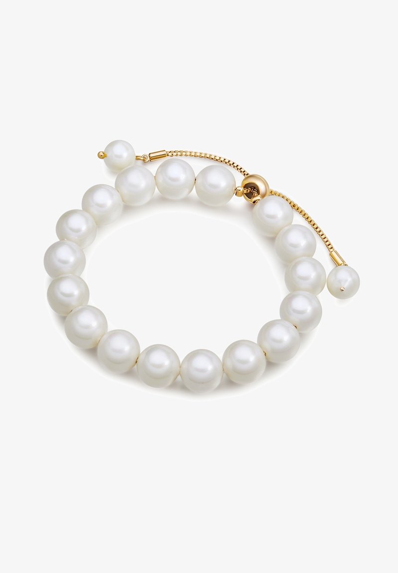 Baltos perlų apyrankė su apvaliais perlais, blizgiu paviršiumi ir auksiniu reguliuojamu užsegimu, užtikrinančiu saugų užsegimą. Lygus paviršius, elegantiškas dizainas.