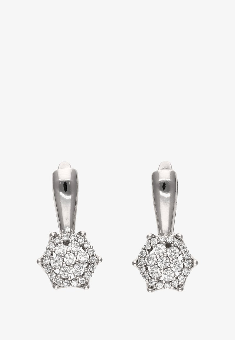 Sølvstjerneformede øreringe med blomsterdesign, prydet med flere små funklende sten, med en glat, poleret overflade.