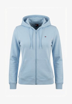 Jasnoniebieska bluza z kapturem zapinana na zamek, z przednimi kieszeniami, sznurkiem w kapturze, ściągaczami na mankietach oraz małym logo Tommy Hilfiger na lewej piersi.
