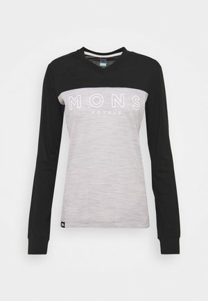 Langärmliges Shirt mit einem schwarzen Oberteil und einem hellgrauen Unterteil. Mit weißem "MONS ROYALE"-Logo über der Brust. Weicher Stoff.