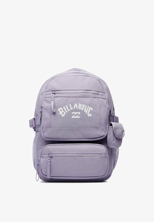 Lilac backpack with multiple zippered compartments, mesh side pocket, small attached pouch, and white "Billabong" logo on front pocket.