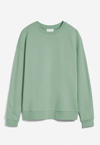 Sweat-shirt vert menthe en tissu doux, avec col rond, épaules tombantes, et ourlet et poignets côtelés. Design simple et minimaliste.