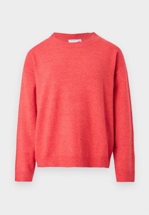 Korallivärvi kudumiga kampsun ümmarguse kaelusega, langenud õmblustega õlgadel, soonikkoes varrukate ja vöökohaga. Pehme tekstuur ning kerge läikiva efektiga.