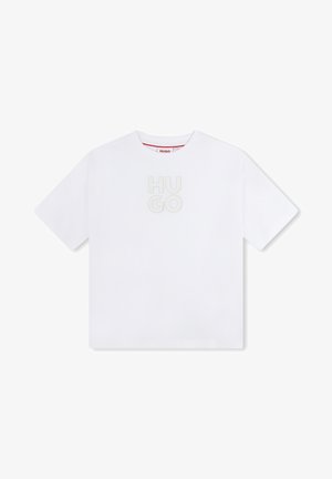 T-shirt en coton blanc à manches courtes, arborant le logo "HUGO" en relief gris clair au centre et une étiquette rouge au niveau du col.