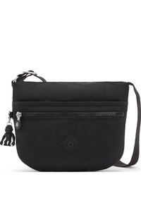 Schwarze Nylon-Crossbody-Tasche mit einer vorderen Reißverschlusstasche, runder Form, Stoffgurt und einem kleinen Affen-Schlüsselanhänger.