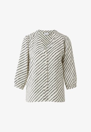 Bluzka zapinana na guziki w kolorze kremowym z ukośnymi czarnymi paskami. Rękawy do połowy łokcia, dekolt w serek i miękki materiał o delikatnym połysku.
