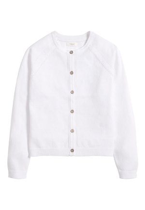 Cardigan blanc à manches longues boutonné, col rond, poignets et ourlet côtelés, avec des coutures subtilement texturées au niveau des épaules.