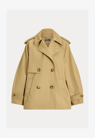 Μπεζ διπλωμένο παλτό τύπου trench με φαρδιά πέτα, επιγονατίδες στους ώμους, μανσέτες με κουμπιά και μπροστινές τσέπες.