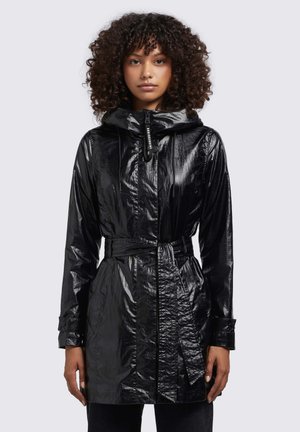 Black, glossy raincoat with a hood, belted waist, and textured finish. Features a zipper with a toggle and button closure. Long sleeves.