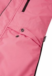 Pink insulated jacket featuring a zippered pocket, snap closure, and black trim. Fabric has a smooth texture with visible stitching details.