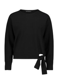 Pull en maille noir à manches longues, encolure ronde et détail à nouer sur le côté gauche. Texture douce et coupe décontractée.
