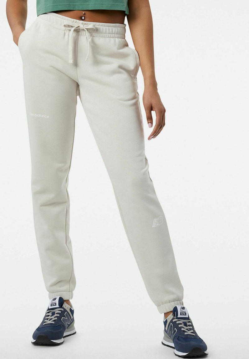 New Balance Trainingsbroek goudkleurig