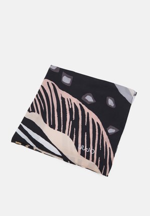 Folded silk scarf with abstract black, beige, and pink patterns and small geometric shapes on a white background.