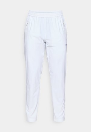 White, elastic waist pants featuring a tapered fit, two side pockets, and subtle branding on the left leg. Smooth texture and lightweight material.