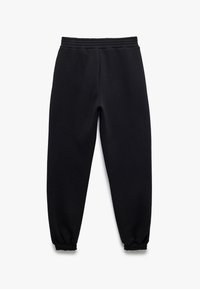 Sorte sweatpants lavet af blødt materiale, med elastisk talje og ribbede manchetter ved anklerne. Klassisk design med lige ben.