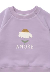 Lavender sweatshirt featuring a white daisy graphic with a brown center and green stem, text "AMORE" in white, ribbed neckline and hem.