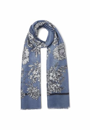 Niebieski szalik z czarno-białymi kwiatowymi wzorami, luźno złożony z frędzlami na krawędziach na białym tle.