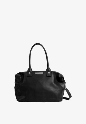 Black leather tote bag with two handles and a detachable shoulder strap. Features a smooth texture, silver hardware, and front accent detail.