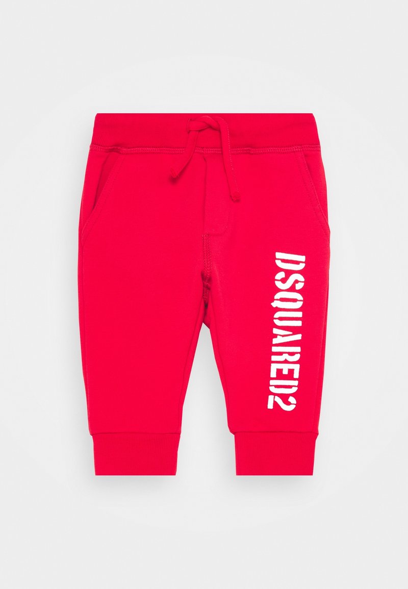 Pantalons de survêtement rouges avec taille élastique, cordon de serrage, poches latérales et impression du logo blanc 'DSQUARED2' le long de la jambe gauche. Matériau en mélange de coton.
