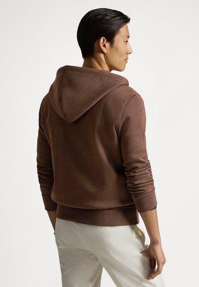Brown hooded sweatshirt with ribbed cuffs and hem, made from a soft fabric. The back view shows a relaxed fit and minimalist design.