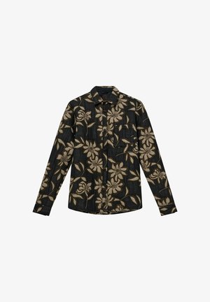 Košulja s dugim rukavima u tamnoj tkanini s velikim bež cvjetnim uzorkom. Ima uski ovratnik, duge rukave i jedan džep na prsima.