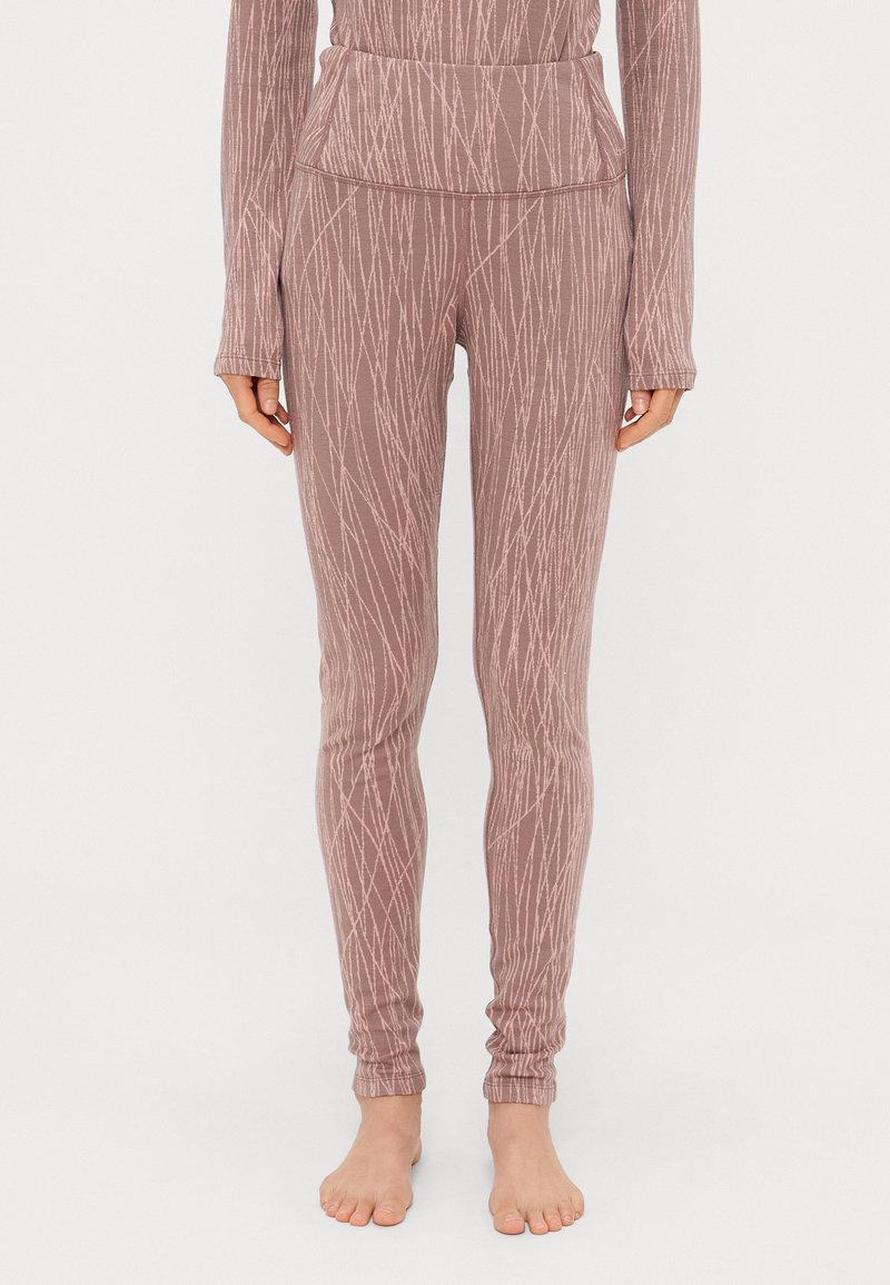 Leggins i myk mauve-stoff med et diagonalt linjemønster, med høy midje og smale anklene. Slitesterk tekstur, ingen synlig maskinvare.