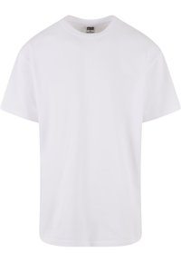Tricou alb cu mânecă scurtă și guler rotund, fabricat dintr-un material neted, având o croială relaxată și un tiv drept. Eticheta este vizibilă la gât.