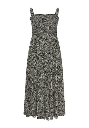 Robe maxi avec des motifs de feuilles et de zèbres noir et blanc ; corsage smocké, bretelles ajustables, jupe fluide, réalisée en tissu léger.