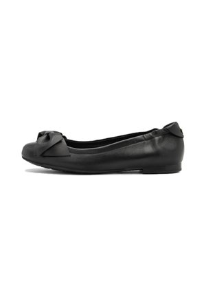 Ballerines en cuir noir avec un bout rond, ornées d'un nœud décoratif à l'avant et d'une texture lisse. Semelle à profil bas.