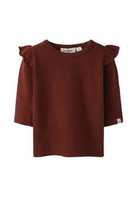 Bordeaux fleecen toppi lyhyillä hihoilla ja olkapäillä röyhelökoristeet. Pyöreä kaula-aukko ja pieni tuotetagi sivussa. Pehmeä pinta.