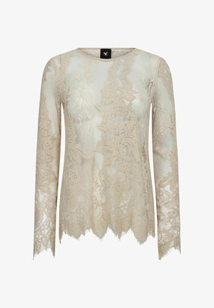 Top bej din dantelă cu mâneci lungi, gât rotund, tiv ondulat și modele florale pe tot parcursul, realizat dintr-un material semi-transparent.