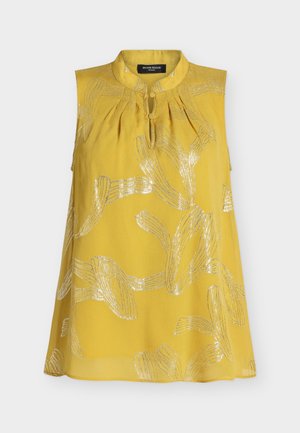 Blouse jaune sans manches avec motifs abstraits de feuilles argent métallisé, encolure goutte d'eau avec bouton en tissu, coupe ample.