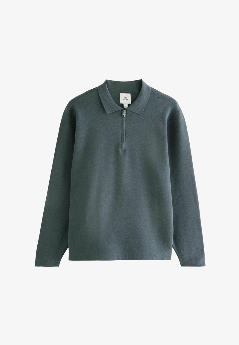 Suéter de un verde oscuro con cuello tipo polo y cierre de media cremallera. Fabricado con un tejido suave, cuenta con mangas largas y un corte relajado.