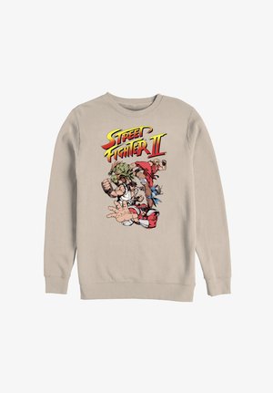 Beige sweatshirt med farverigt Street Fighter II-logo og figurer i dynamiske kampstillinger på midten af forsiden.