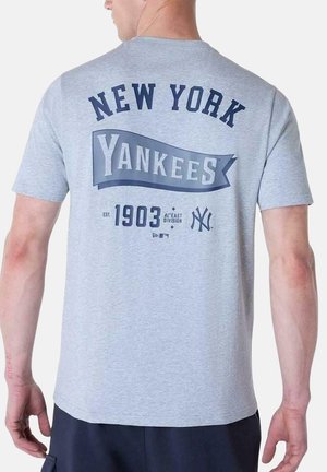 Gray short-sleeve t-shirt featuring "NEW YORK YANKEES" in navy text, with a banner and year established (1903) printed on the back.