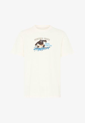 T-shirt beige avec un graphisme d'un gorille surfant sur des vagues bleues, texte au-dessus et à côté indiquant "POWERFUL WAVES Surfing, Diving Team."