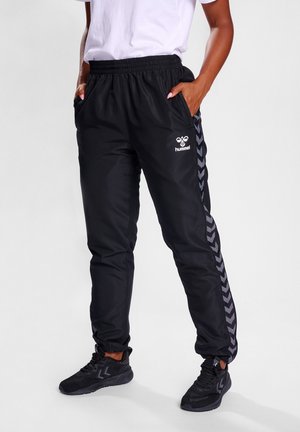 AUTHENTIC - Tracksuit bottoms - black